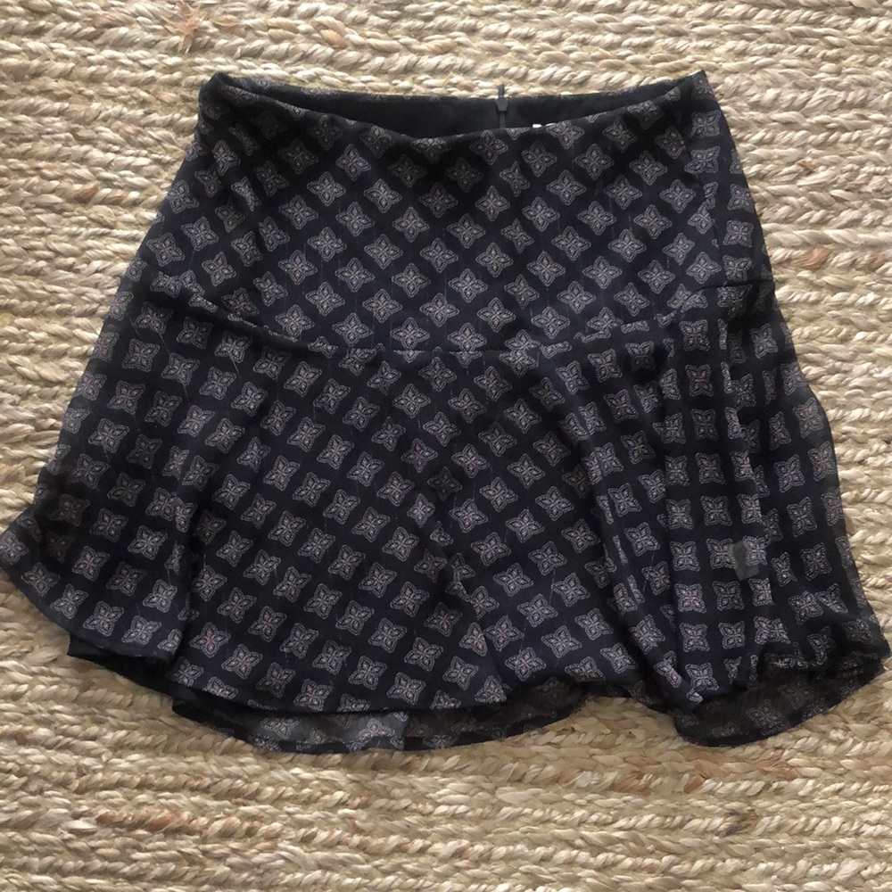 Black mini flare skirt with pattern